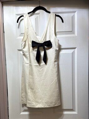 Elegant White Dress with Black Bow